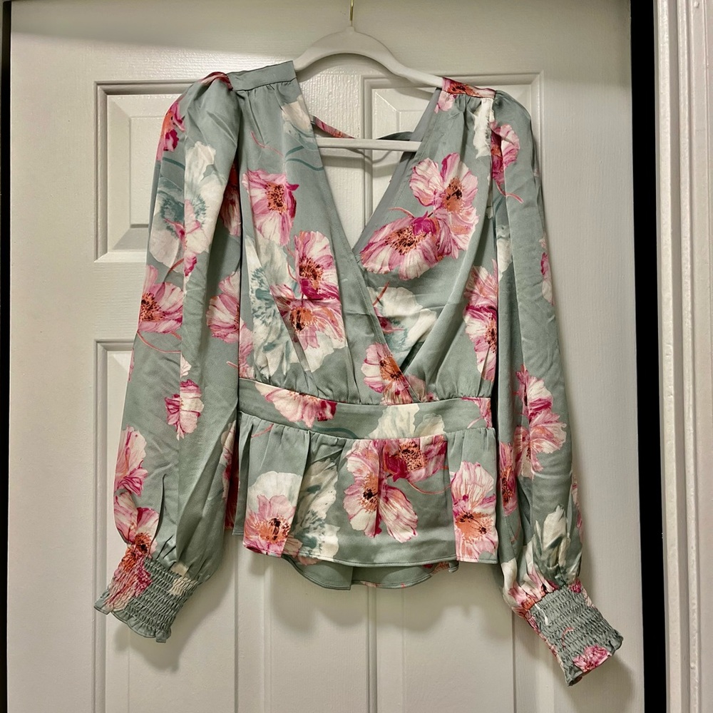 Lovely floral Express brand new Long sleeve sexy top. Medium